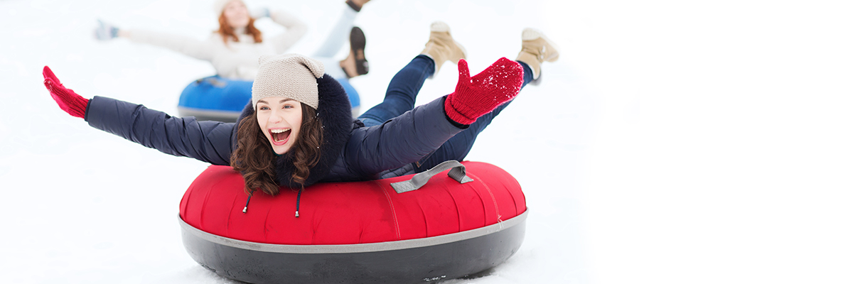 two women tubing wintersports